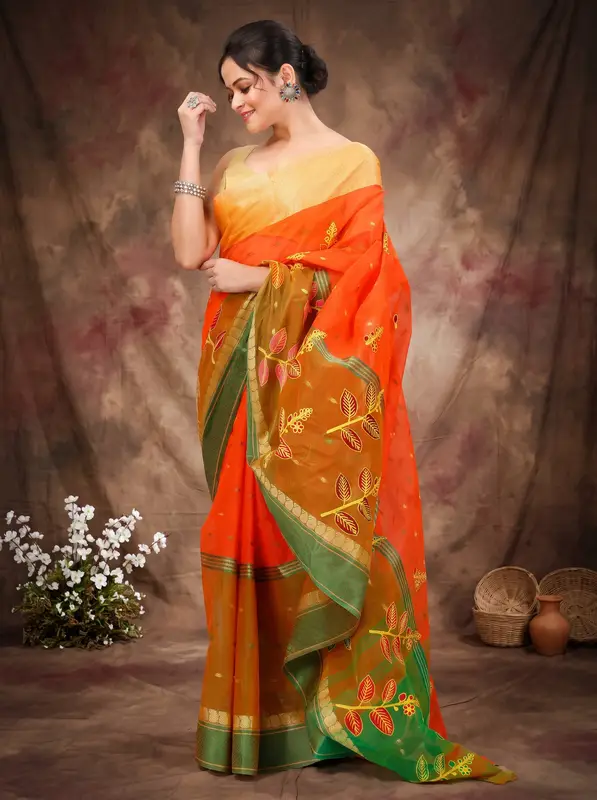 DipDiya Pure Cotton Orange Green Embi Ganga Pata Wrapped in Heritage Embroidery Tant Sarees