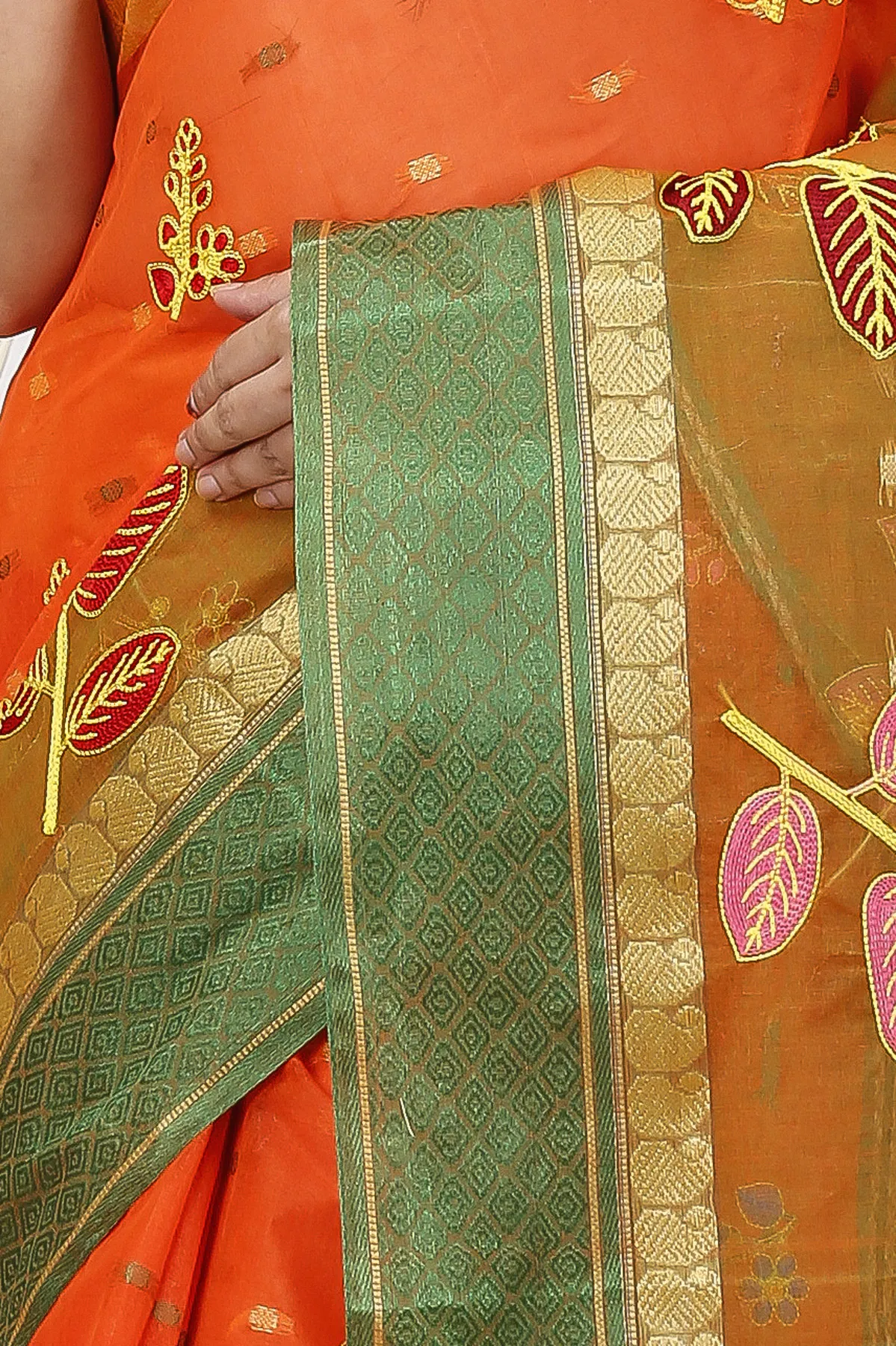 DipDiya Pure Cotton Orange Green Embi Ganga Pata Wrapped in Heritage Embroidery Tant Sarees