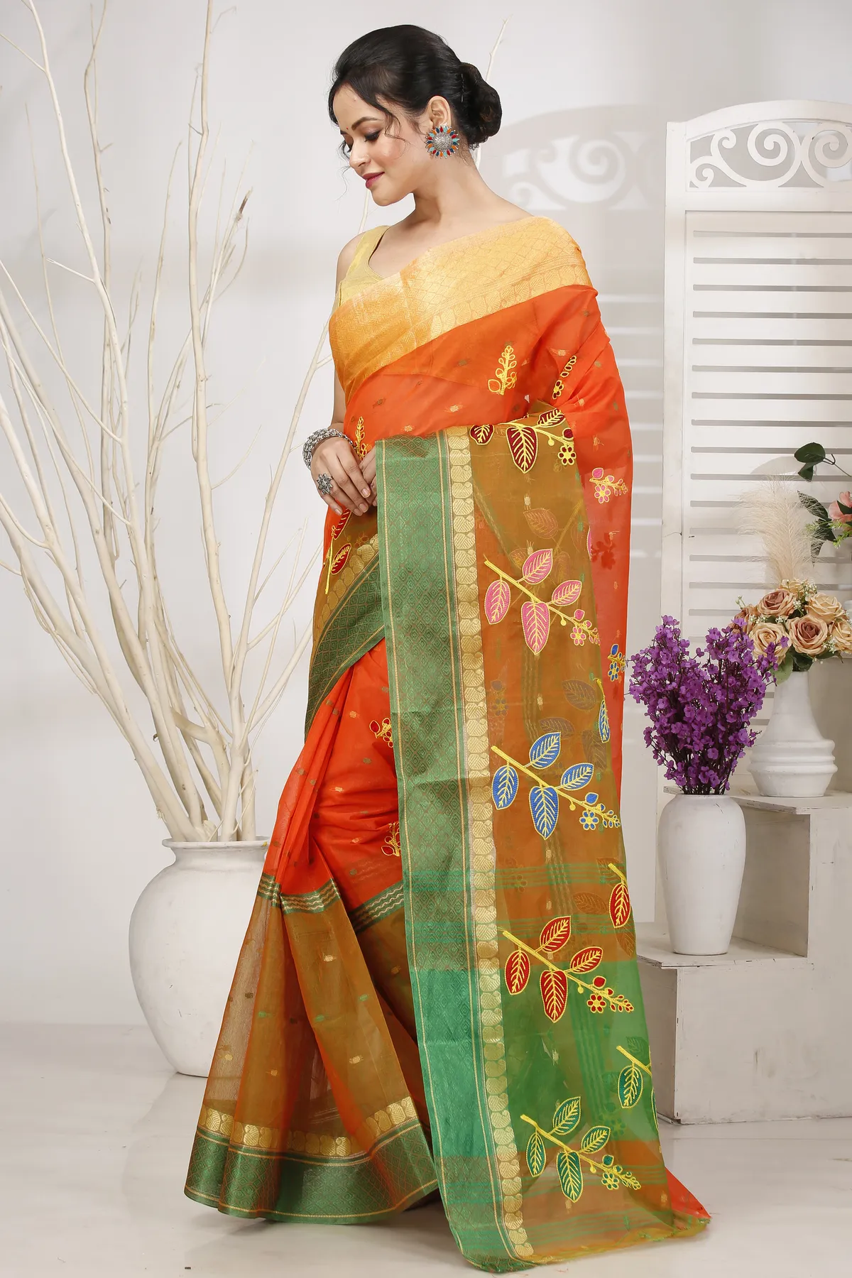 DipDiya Pure Cotton Orange Green Embi Ganga Pata Wrapped in Heritage Embroidery Tant Sarees