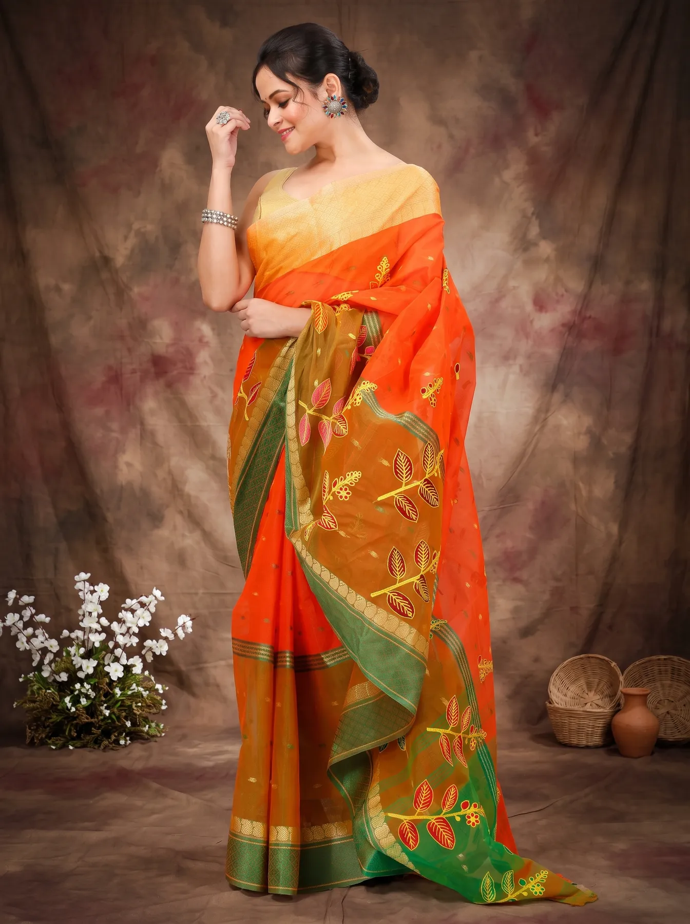 DipDiya Pure Cotton Orange Green Embi Ganga Pata Wrapped in Heritage Embroidery Tant Sarees