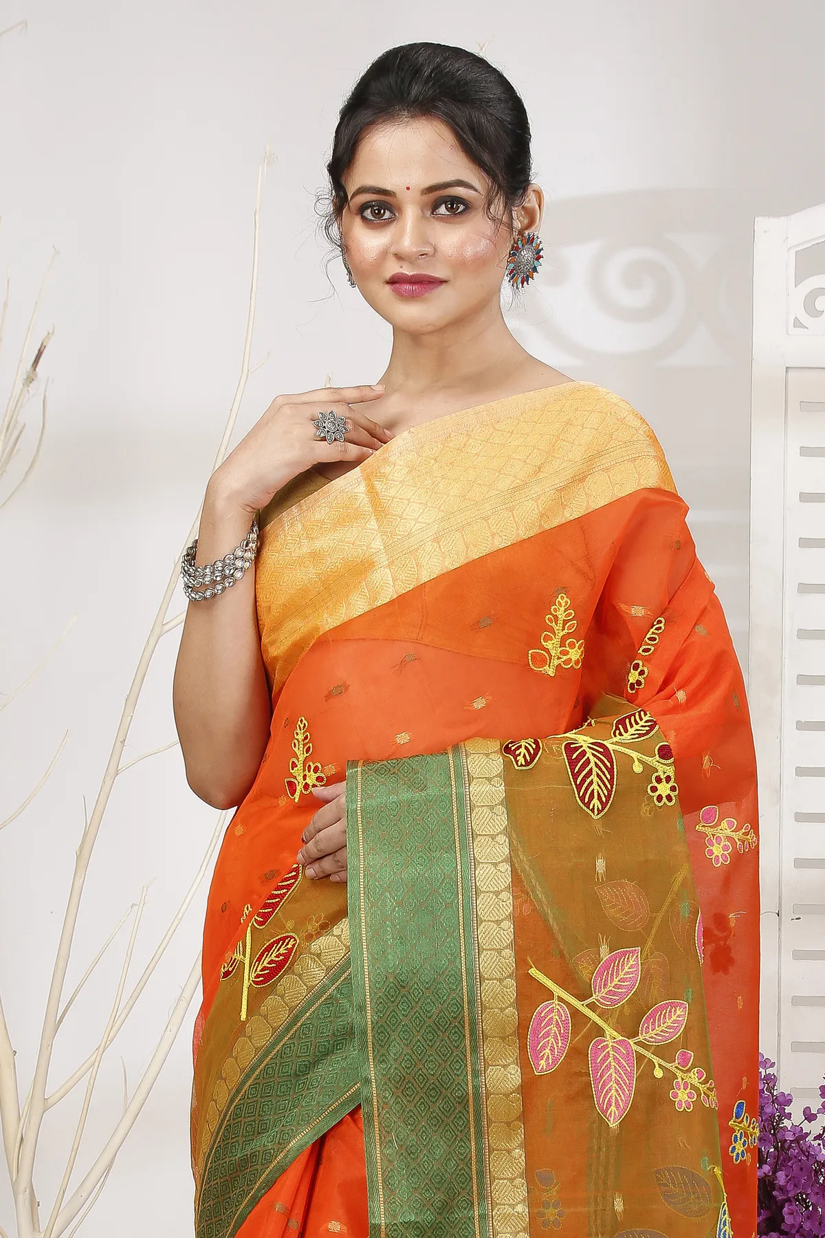 DipDiya Pure Cotton Orange Green Embi Ganga Pata Wrapped in Heritage Embroidery Tant Sarees